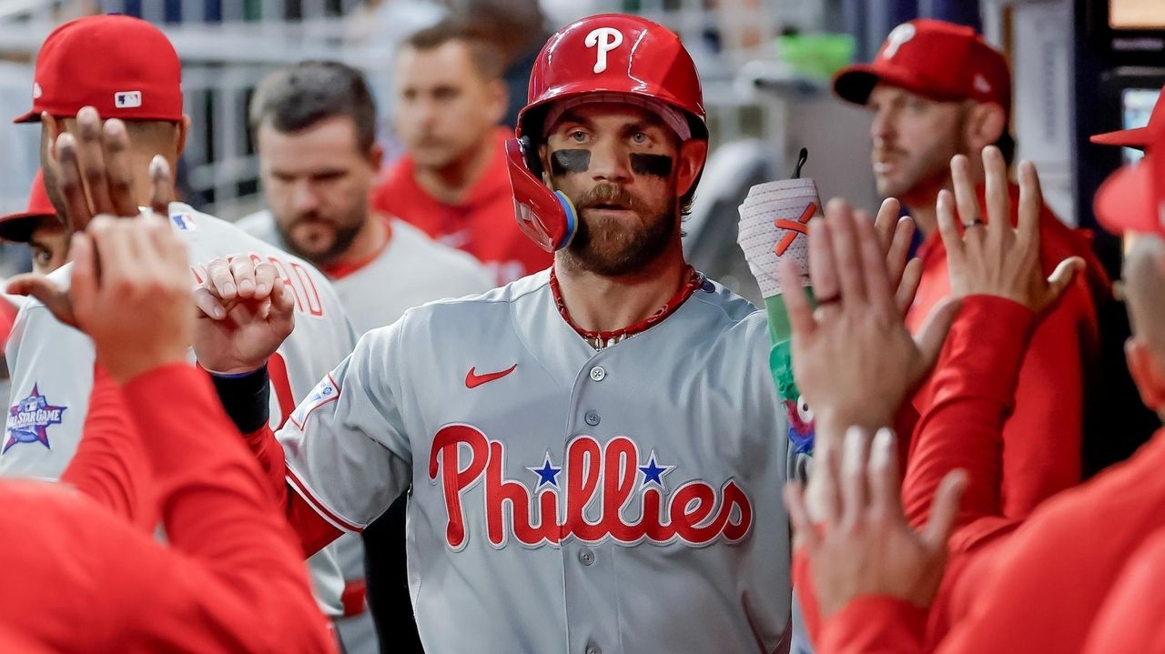 Bryce Harper had four RBIs, including a tiebreaking single in the 10th inning, and the Philadelphia Phillies snapped the