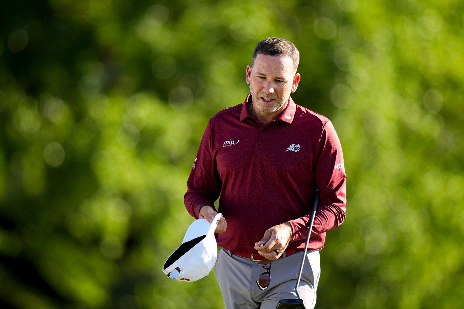 Sergio Garcia slams club in frustration then carries Jon Rahm's bag during Masters final round