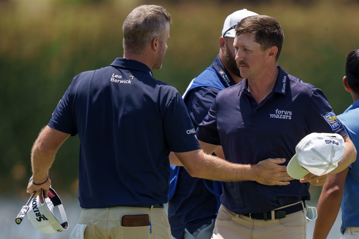 Mackenzie Hughes' errant tee shot hits cameraman, then bounces onto green at Truist Championship.
